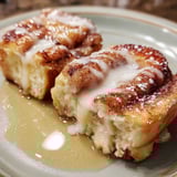 A plate of cinnamon roll french toast bites.