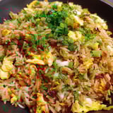 A bowl of egg fried rice.