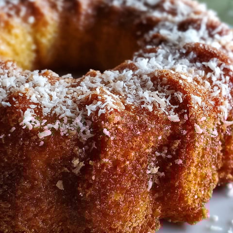 A close up of a delicious apple cider donut cake.